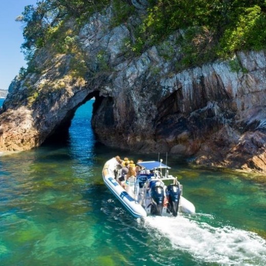 a man riding a wave on top of a body of water
